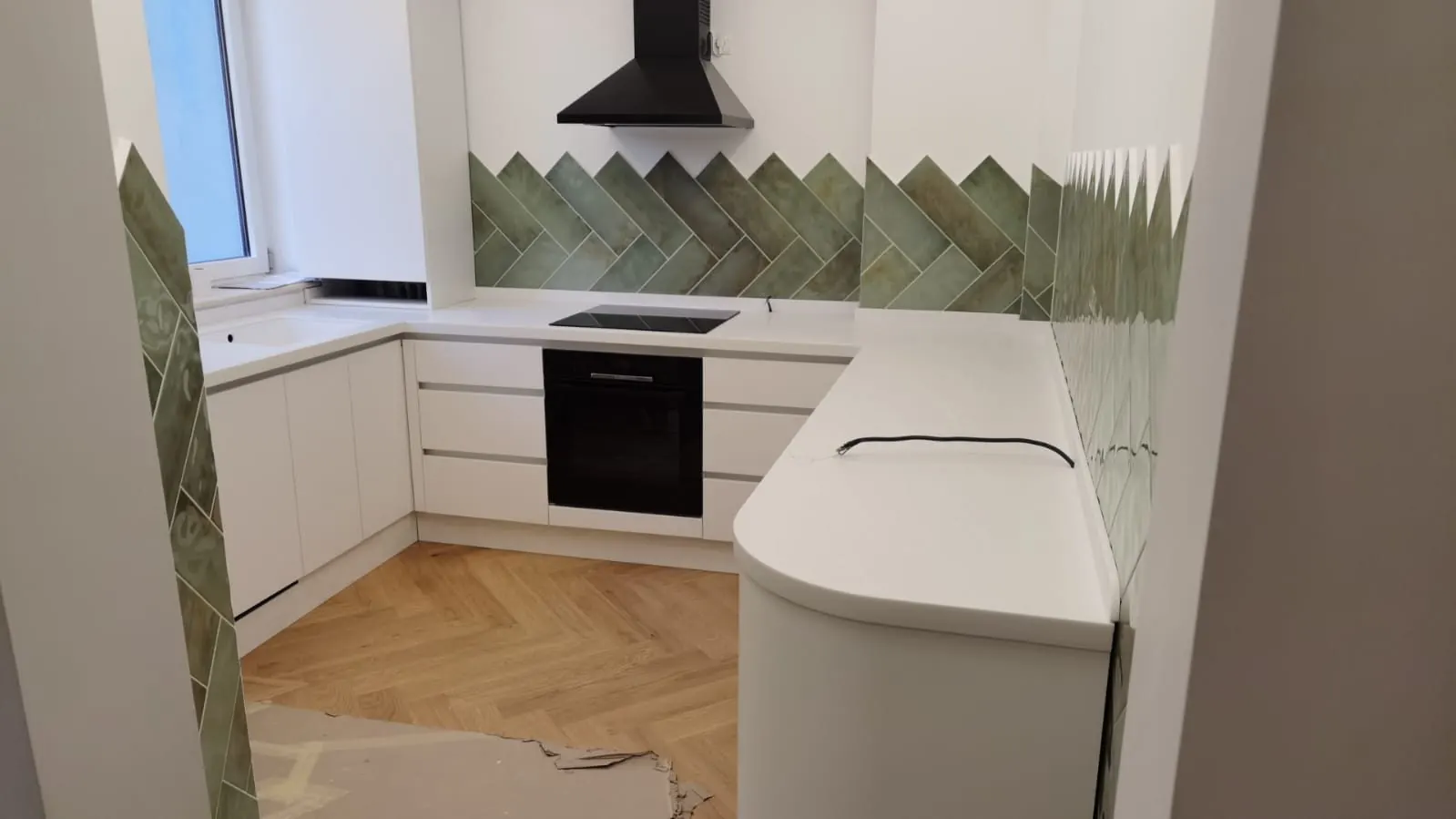 White corner kitchen with a curved worktop