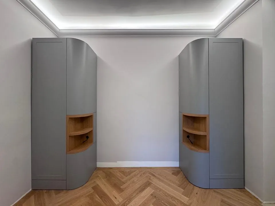 Grey cabinets with rounded wooden niches