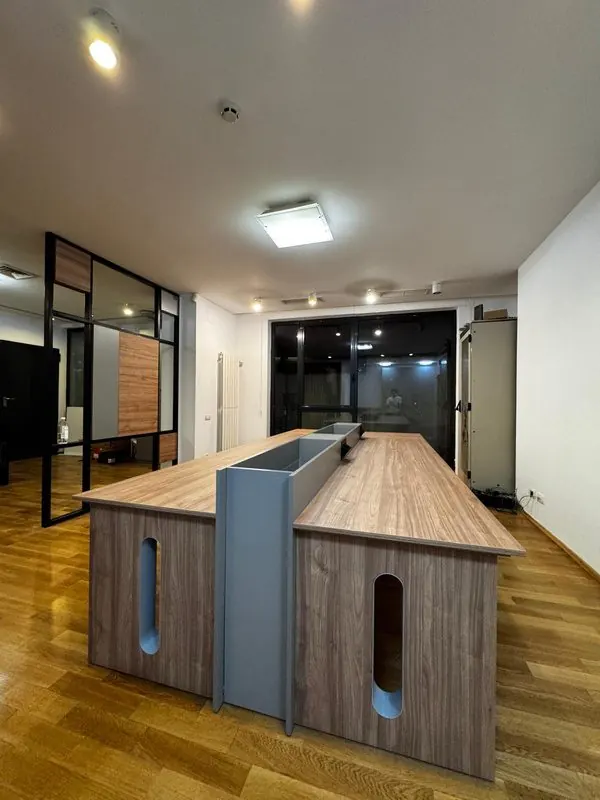 Open-plan office with melamine desks and dividers